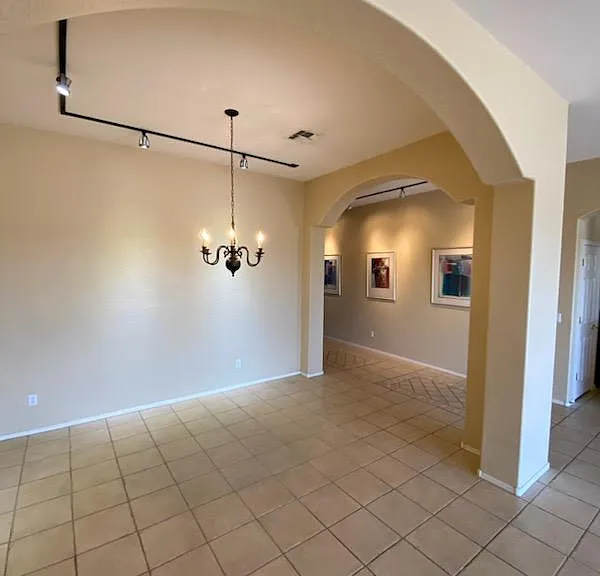Large, entertainer's dining room area with overhead spotlight wall features. Picture taken November 13, 2023.
