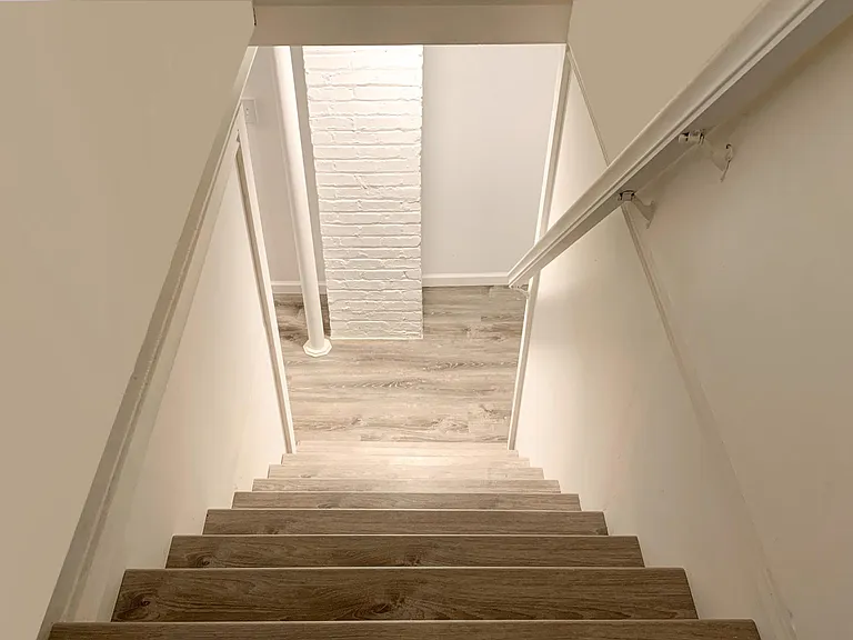Stairs in kitchen leading down to the basement.