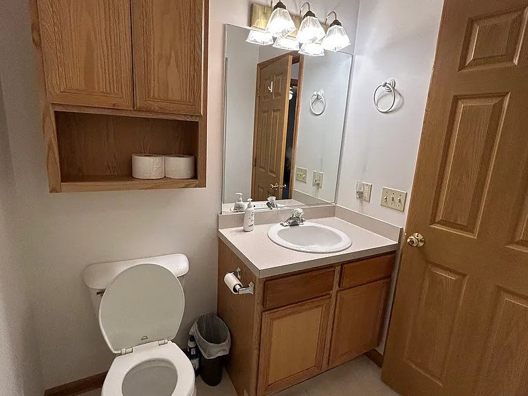 Main upstairs bathroom in hallway with walk in shower