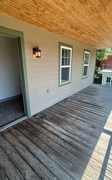 Private covered balcony off the primary bedroom
