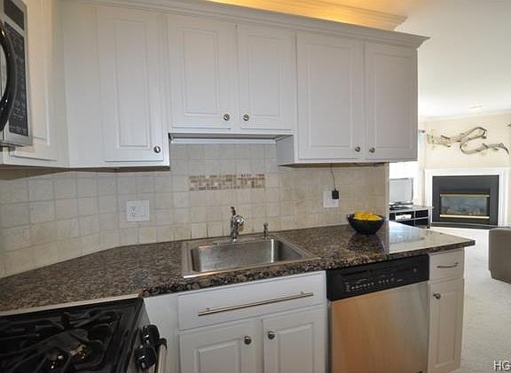 New Kitchen with Granite Counters and Stainless Steel Appliances