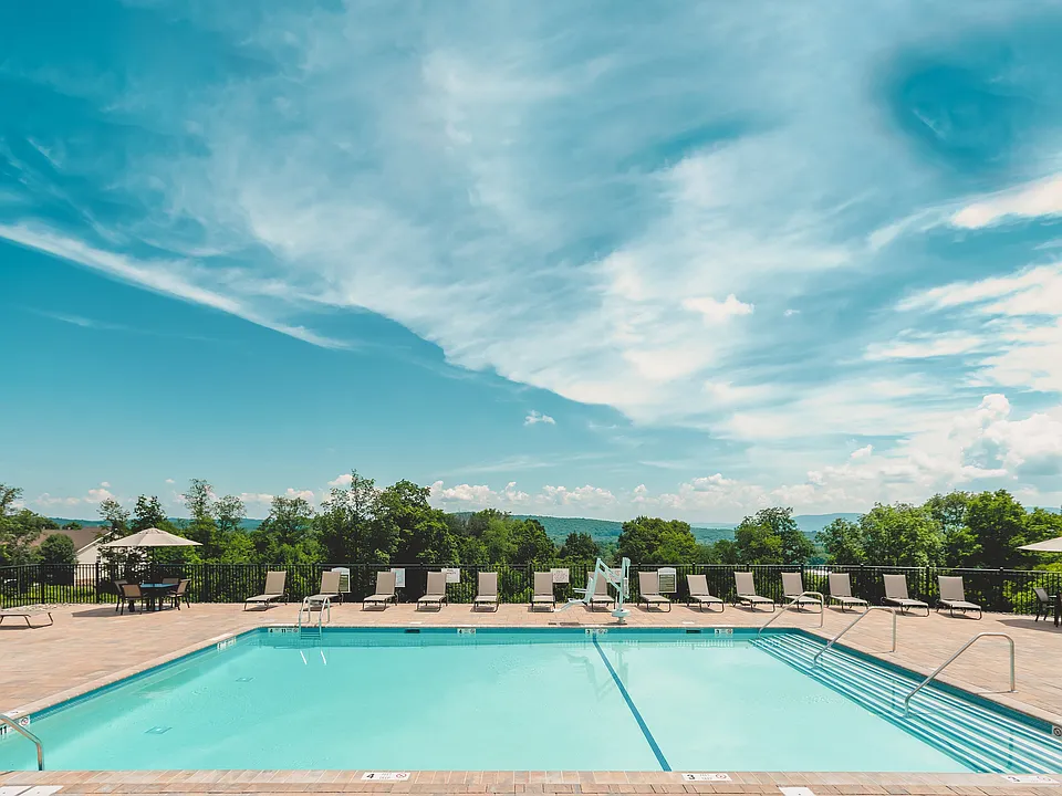 Experience relaxation by the heated outdoor pool, perfect for basking in the sun or enjoying a refreshing swim.