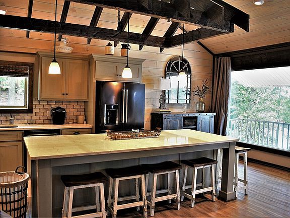 Image 5: Lake view from 2 picture windows in the kitchen