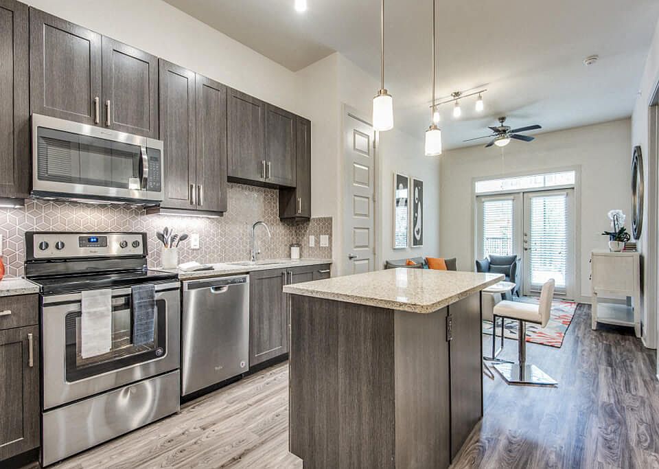 Inwood Stations offers chef-caliber kitchens with elegant cabinetry and tile backsplash. This color scheme is Smoky with a grey tile backsplash.