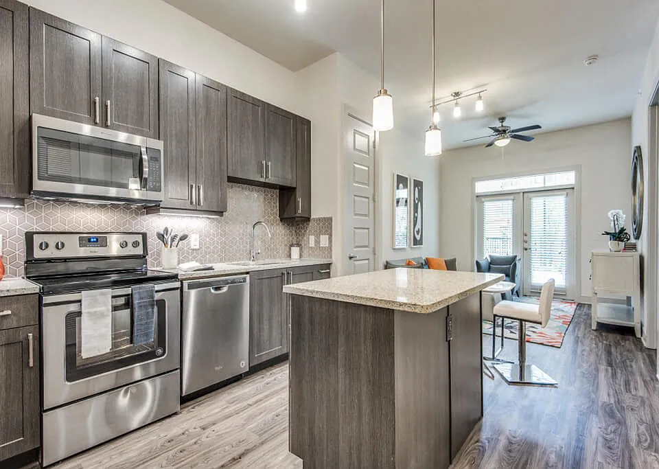 Inwood Stations offers chef-caliber kitchens with elegant cabinetry and tile backsplash. This color scheme is Smoky with a grey tile backsplash.