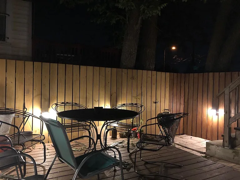 Nightime view of built in lighting back patio area.