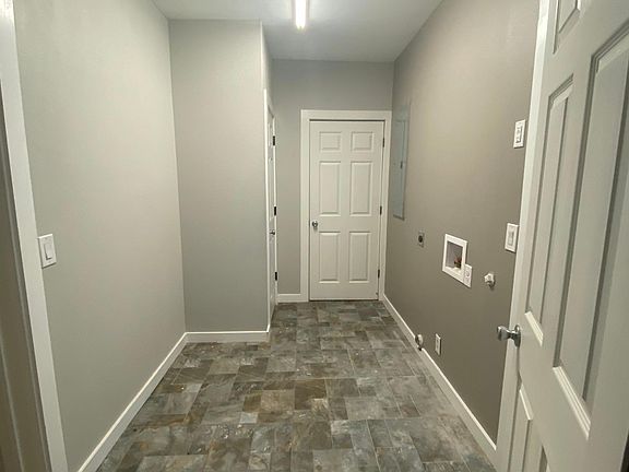 Laundry room. There is a backdoor in this room, a small storage closet, and large pantry.