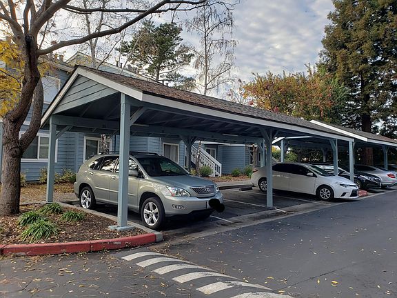 Assigned carport parking in front of unit