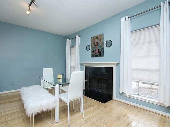 A nice central fireplace enhances the liveability of this spacious, light-filled family room.