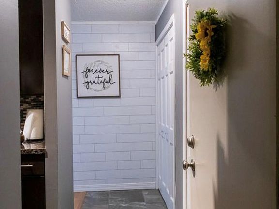 Entry way with two large closets in the hallway