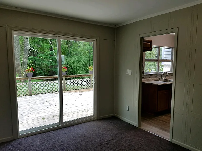 Dining room off of the kitchen and access to deck and back yard