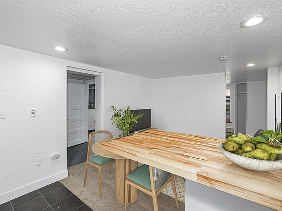 This image shows a virtually furnished space. This space come unfurnished.