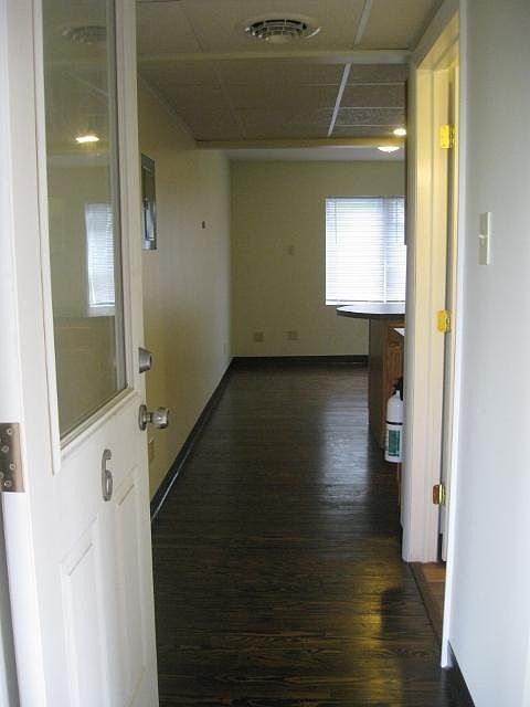 Entrance (from a covered porch). Bathroom immediately on right, kitchen in the middle, living space in the back.