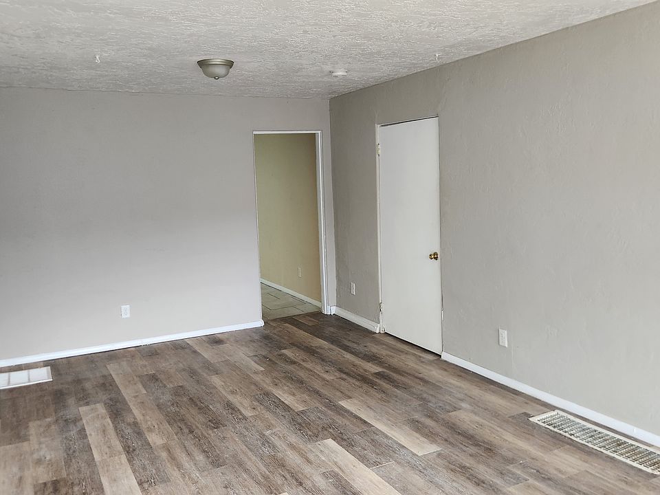 Living room view towards bedroom and kitchen