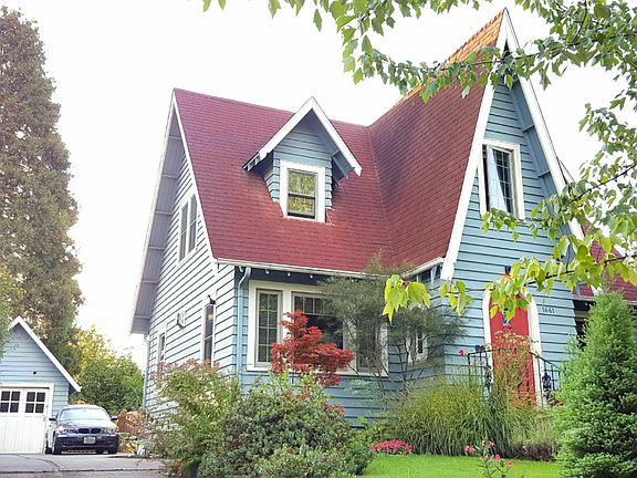 Front view with 1-car garage