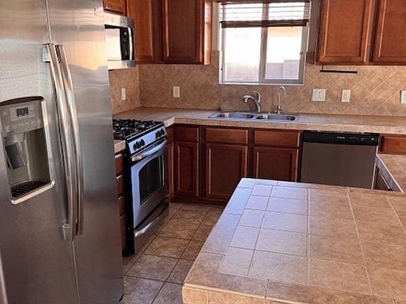 5th image of 11607 E 25th Pl