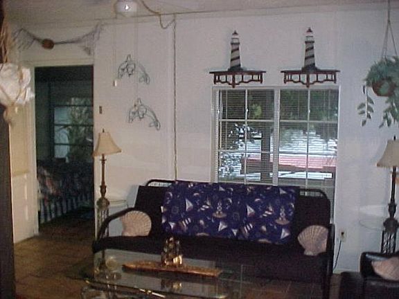 living room picture window Looking out to the Lagoon....dock and Launching ramp