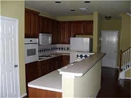 high serving bar, lots of counters and refrigerator stays!