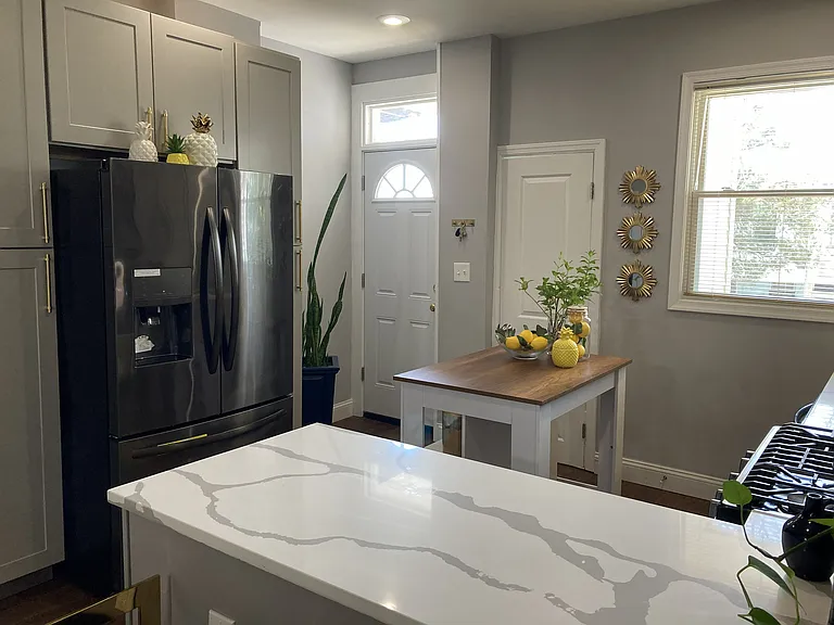 Kitchen and door to out door space. Updated appliances.