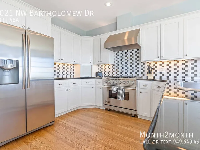 9021 NW Bartholomew Dr — Photo 20