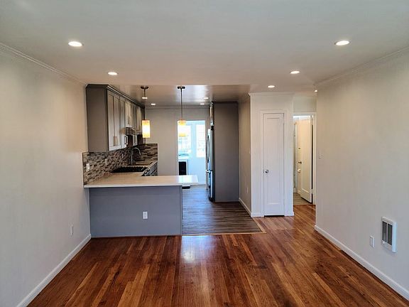 Living room facing the open kitchen.