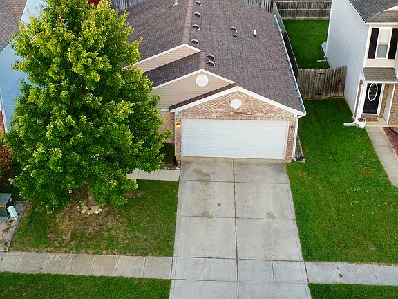 Single-family detached home with a yard.