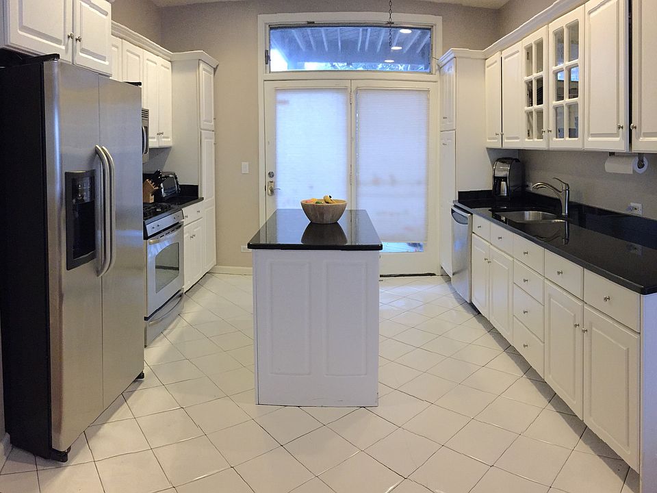 Kitchen w/ granite counter-tops and SS Appliances