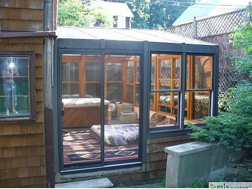 Lg Solarium with Spa overlooks yard
