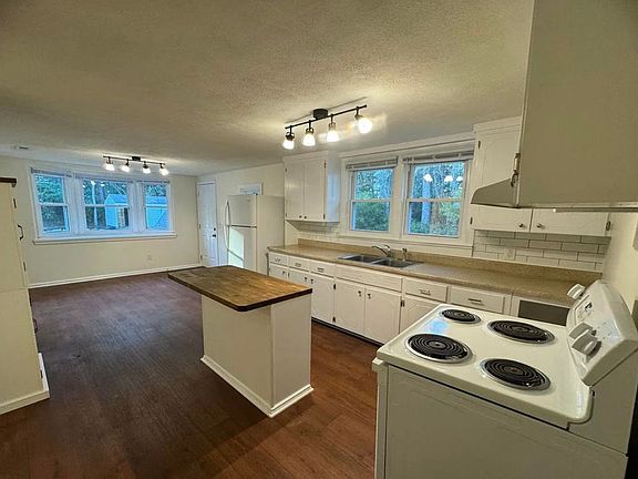 Another view of kitchen with dining area