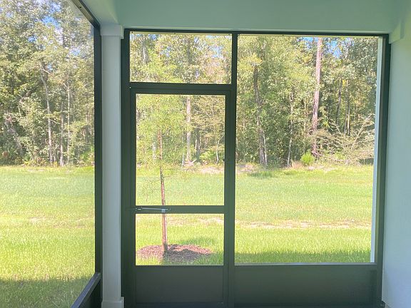 Screened lanai backing preserve area.