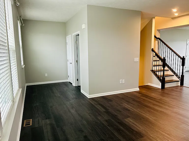 Two doors lead to a half bath and a closet