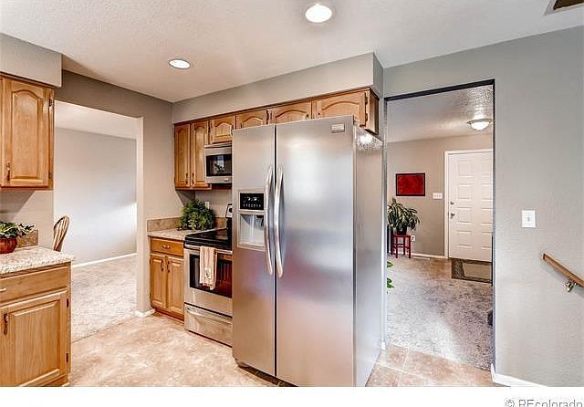 Kitchen with granite and stainless appliances