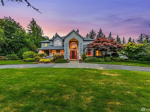 Located in the gated, quiet, walkable community of the Ridge at Lake Webster, this home offers an abundance of privacy and exquisite, meticulously maintained landscaping throughout it's 2.25 acres. 