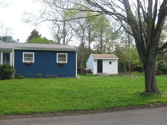 Large shed for extra storage, raised beds for gardening