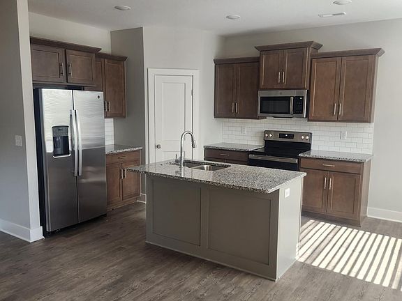 Beautiful Cabinets and center island with bar top