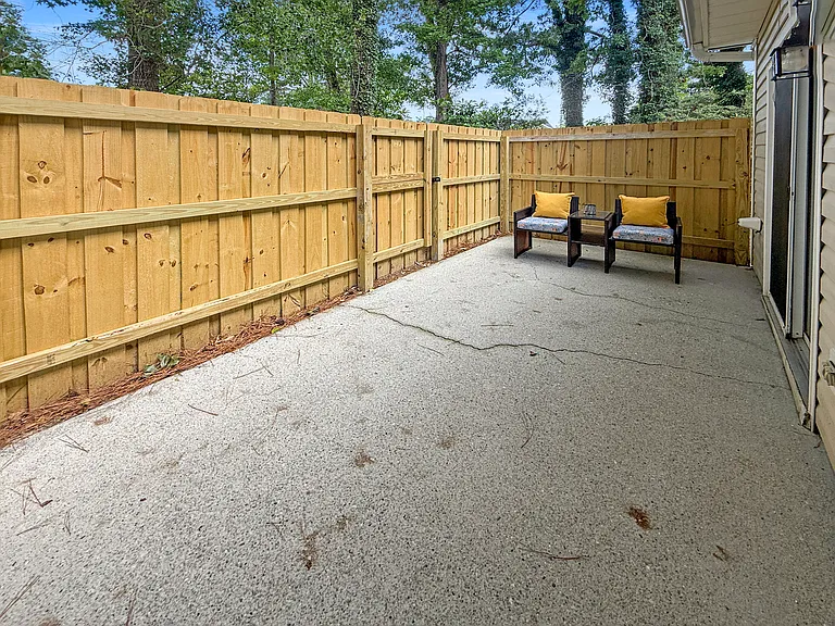 Private outdoor patio with outdoor furniture
