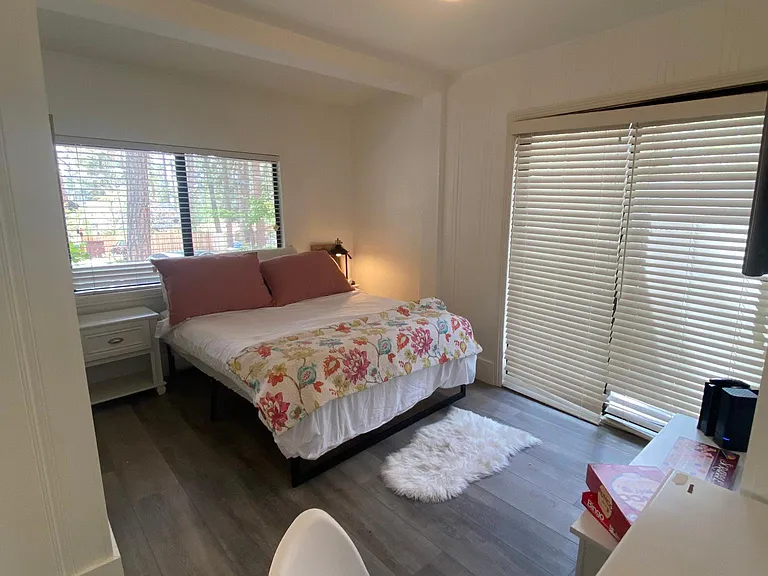 Desk area in downstairs bedroom with slider that goes out to backyard private deck