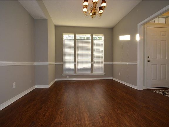 Spacious Dining Room with Lots of Natural Light....Lifetime no Worry Floors Throughout
