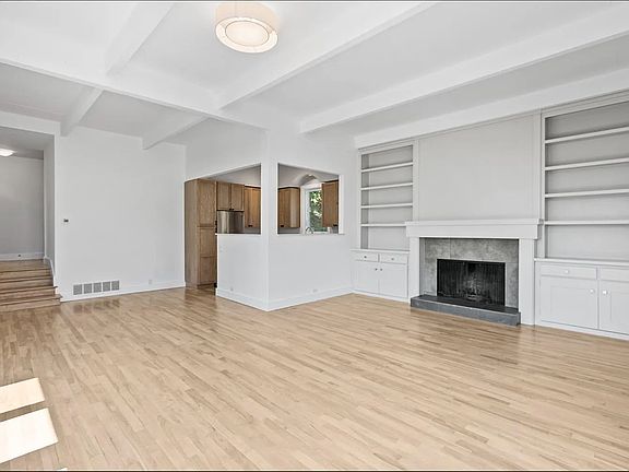 Built-in book shelves and fireplace.