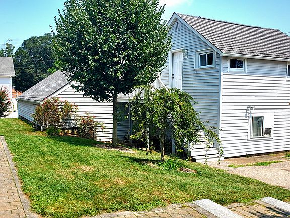 Stairs (behind trees) leading up to private porch and apartment.