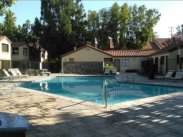Community pool with laundry facility next to it