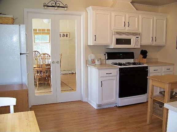 Kitchen with french doors to dining room/family room