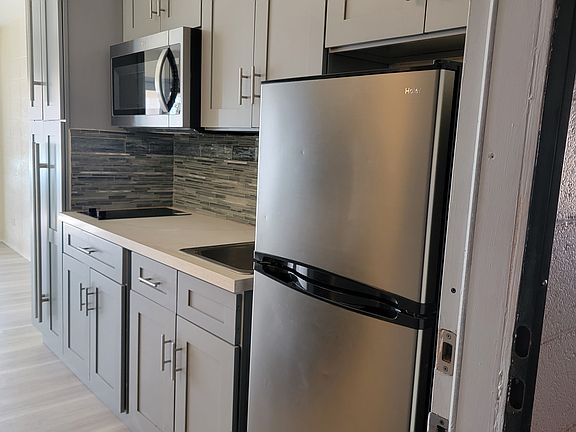 Galley kitchen area as you come in from entrance door