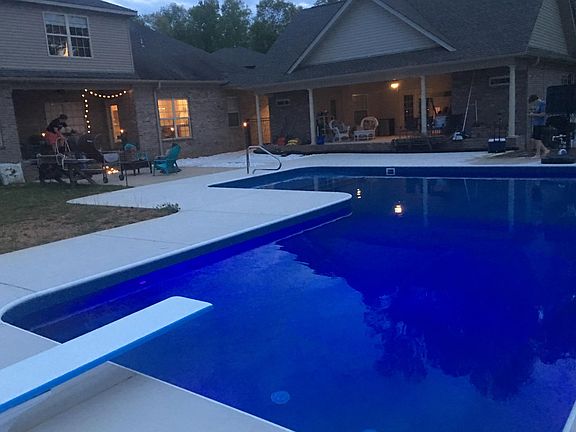 Pool area facing back of main house and guest house.