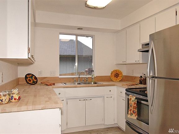 New paint, hardware, floors and butcherblock counters! Awesome!!!