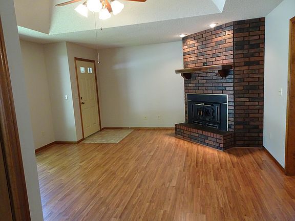 Raised ceiling in front room with ceiling fan, and beautiful