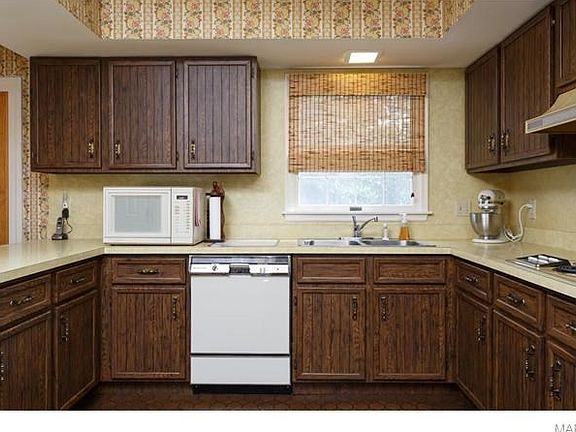 Kitchen with plenty of cabinets, pantry and open to breakfast room.