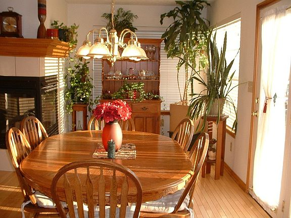 Breakfast Nook situated for enjoyment of 3 sided fireplace.