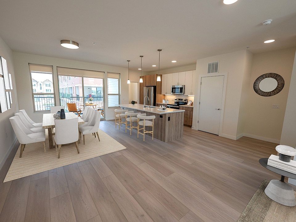 Row House Kitchen and Dining spaces are bright with natural light