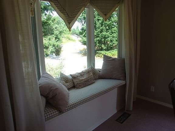 Bay window in dining room has wonderful views to beautiful backyard.